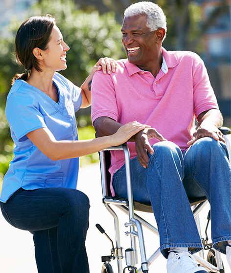 Caregiver Kneeling with Senior